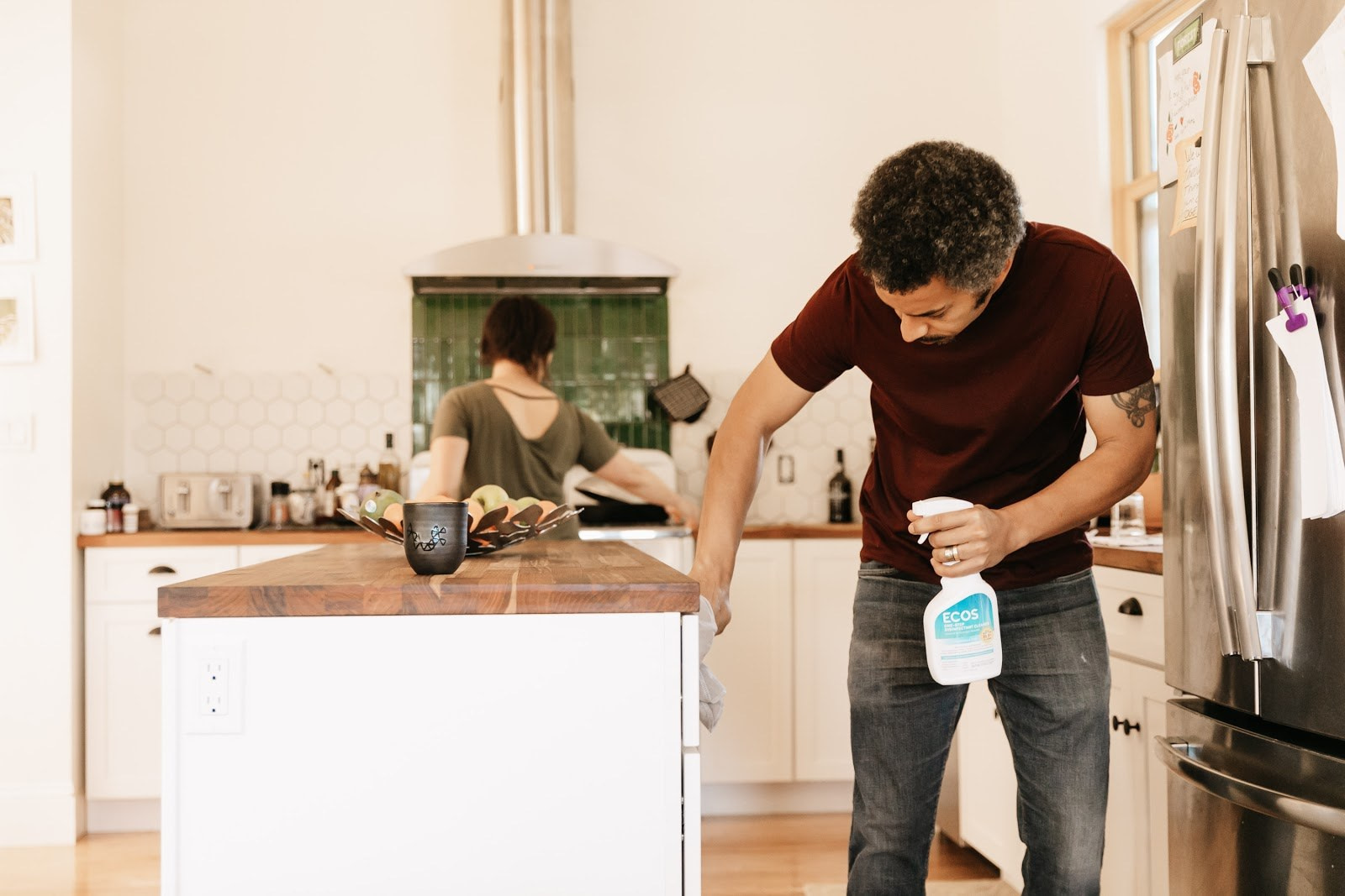Man Cleaning Kitchen With Fragrance Free Disinfectant