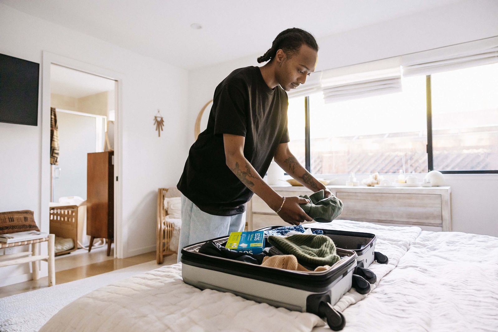 Man Packing Suitcase