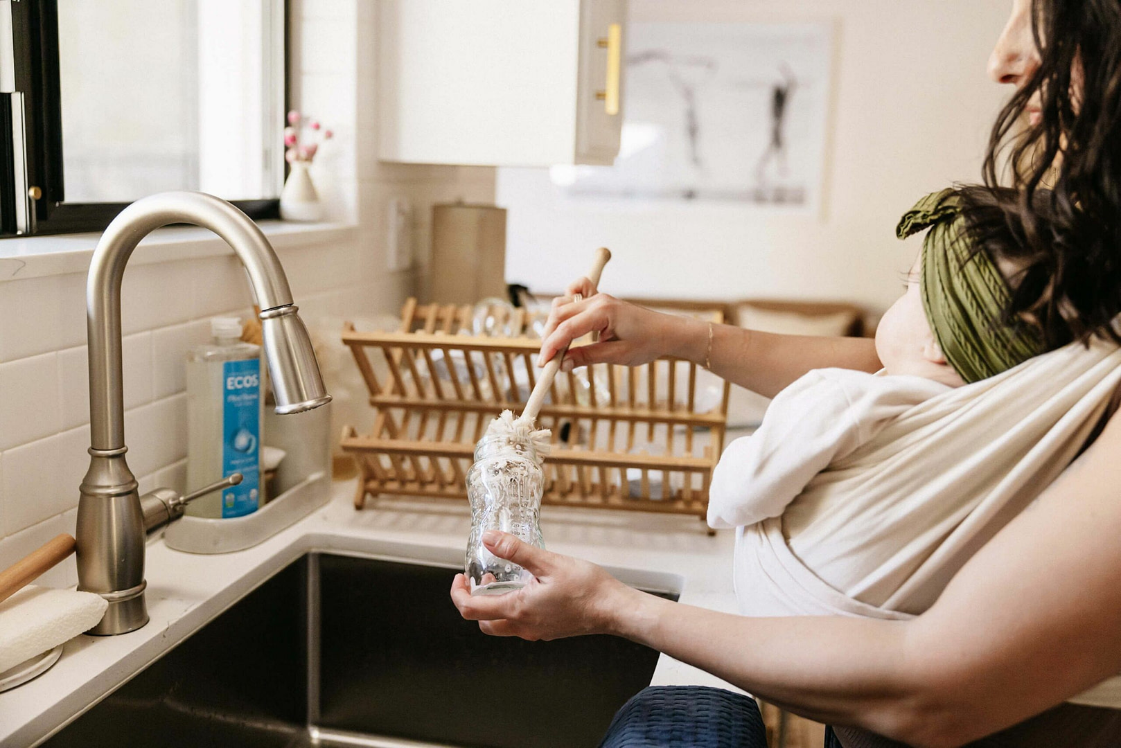 Mother Washing Baby Bottle