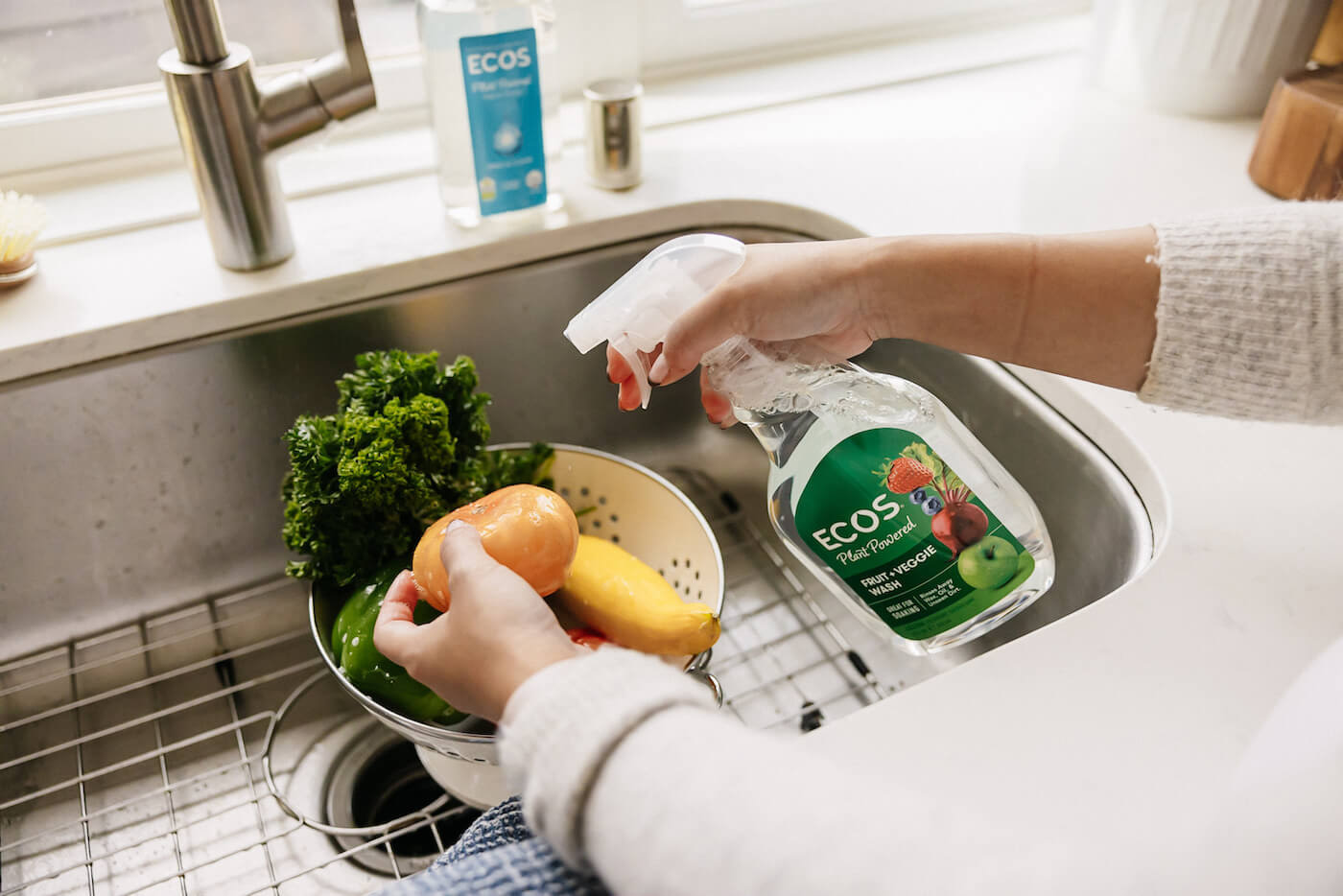 Spraying ECOS Fruit and Veggie Wash on Produce