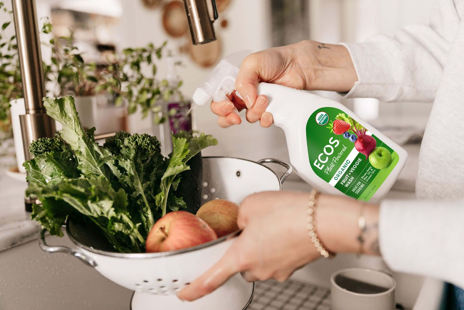 Spraying Organic Fruit Veggie Wash On Produce