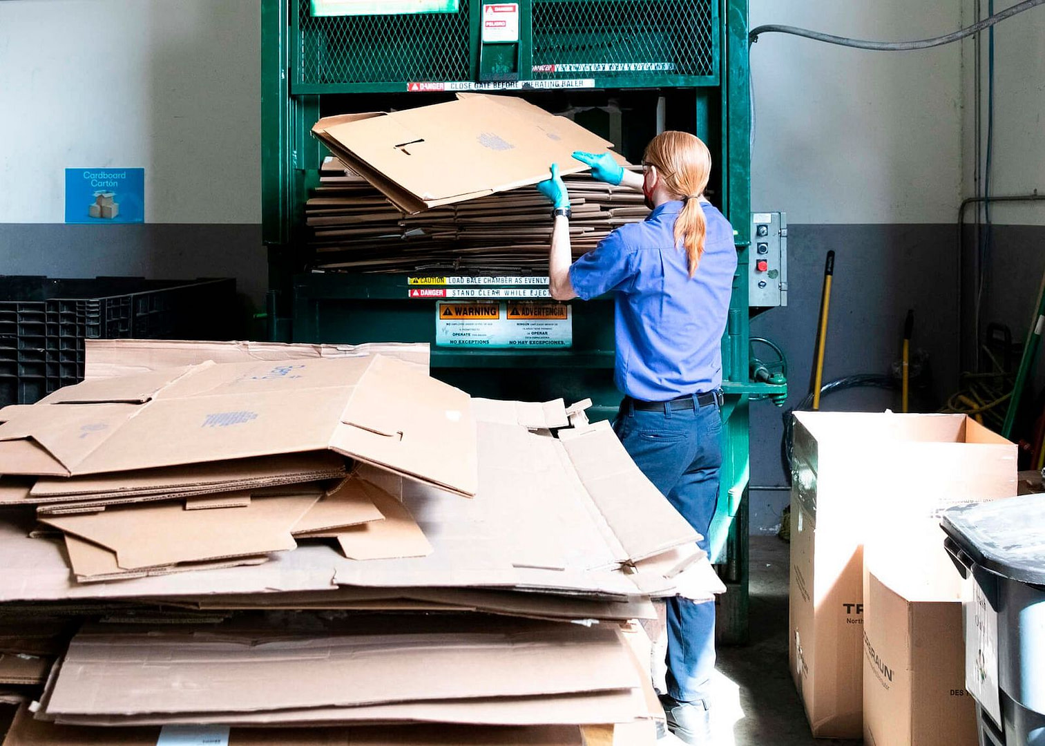Worker Recycling Cardboard