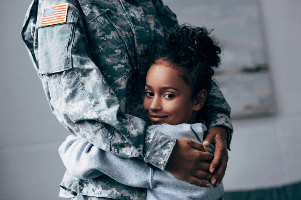 Girl Hugging Mother In Fatigues
